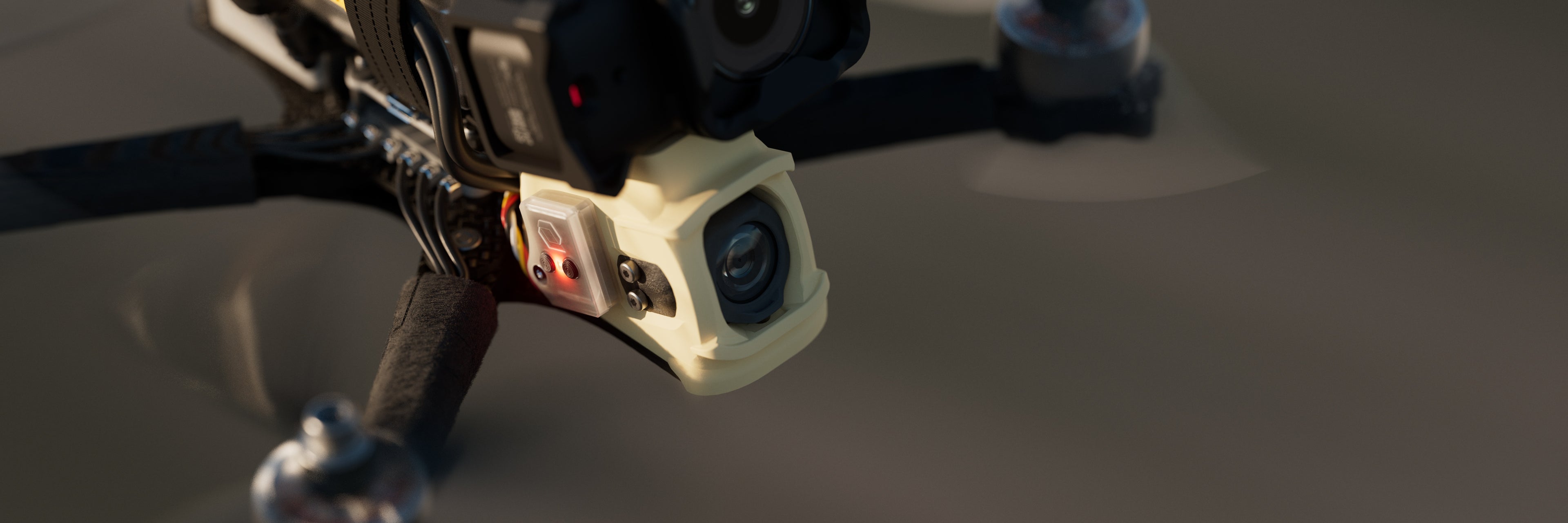 Flying ERA FPV drone with CAMLINK module attached, blinking red.